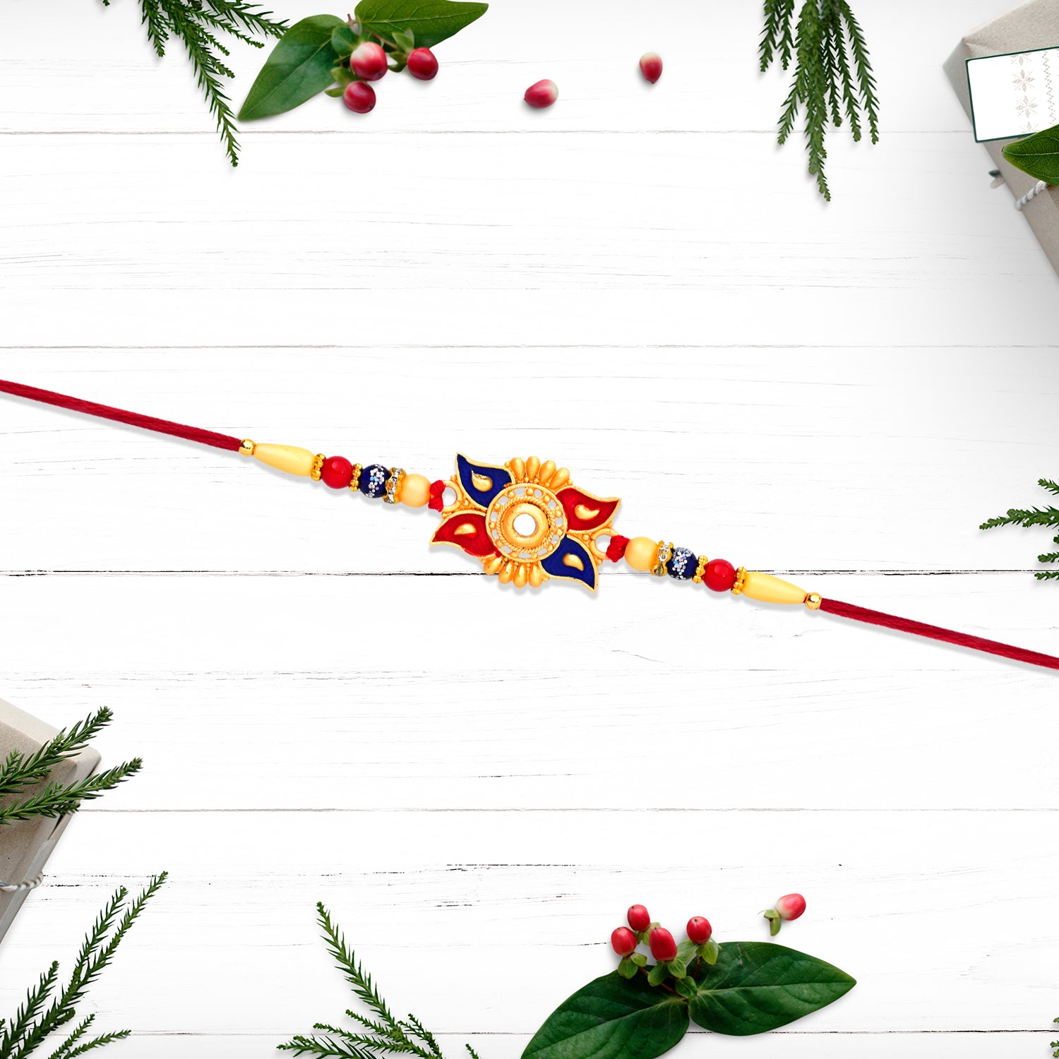 Designer Sun Motif Rakhi With Red And Blue Enamel Work Designer Sun Motif Rakhi With Red And Blue Enamel Work